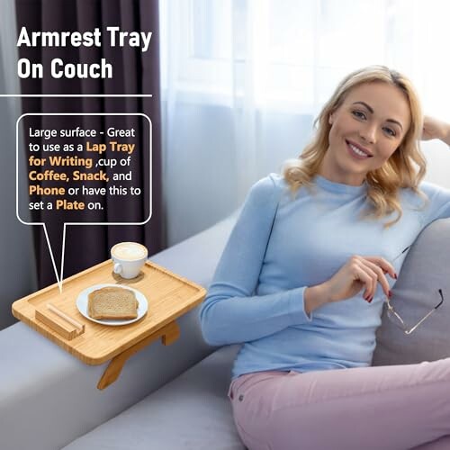 Woman sitting on couch next to armrest tray with coffee and toast.