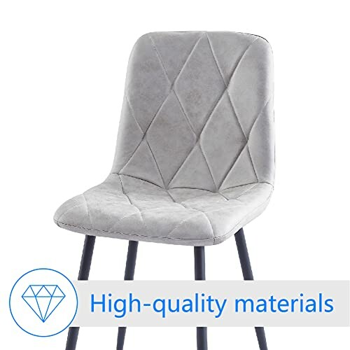 Gray upholstered chair with diamond pattern and high-quality materials sign