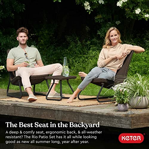 Two people relaxing on Keter Rio Patio Set in backyard.