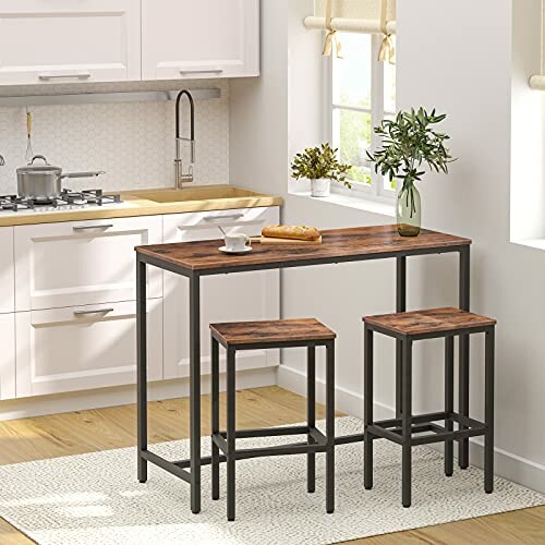 Modern kitchen with a wooden table and two stools.