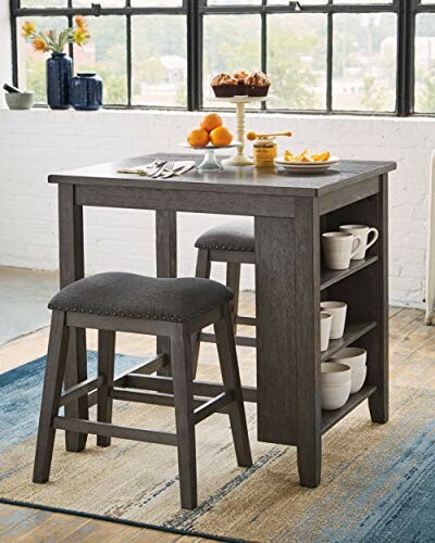 Modern kitchen island table with stools and shelves, featuring fruit and mugs, perfect for a cozy dining experience in any home.