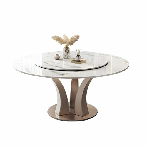 Round marble table with decorative items on top