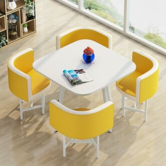 Modern dining table with yellow chairs and a blue vase.