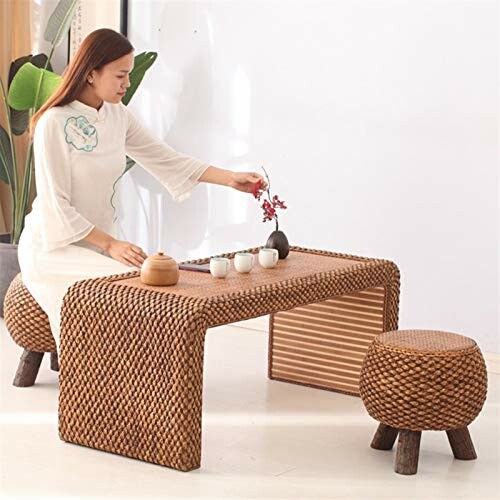 Woman performing a tea ceremony with rattan furniture